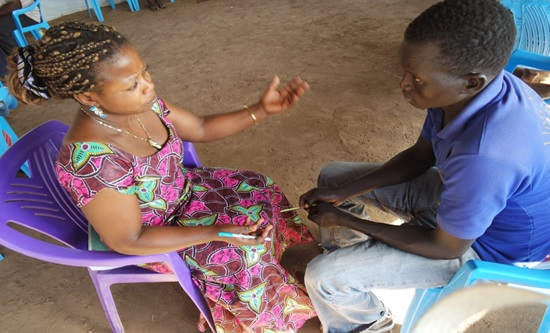 A lady from DRC Congo engaging a man from South Sudan in recent workshop at Kakuma camp in Kenya